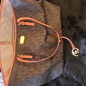 Michael Kors Logo Tote with orange trim.